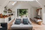 The pretty lounge area comes complete with a sofa made for two and an additional seat for curling up on with a good book