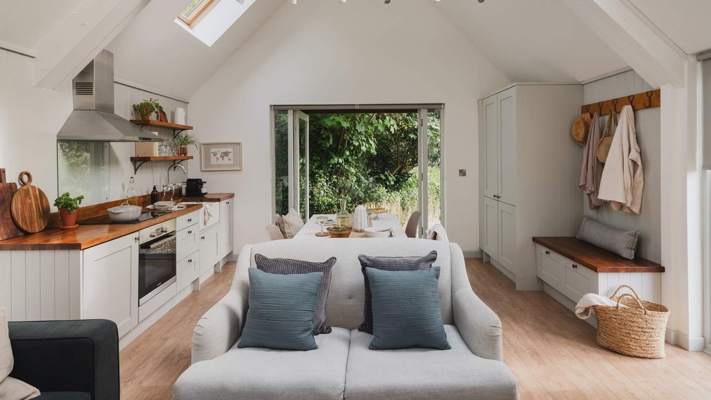 The pretty lounge area comes complete with a sofa made for two and an additional seat for curling up on with a good book