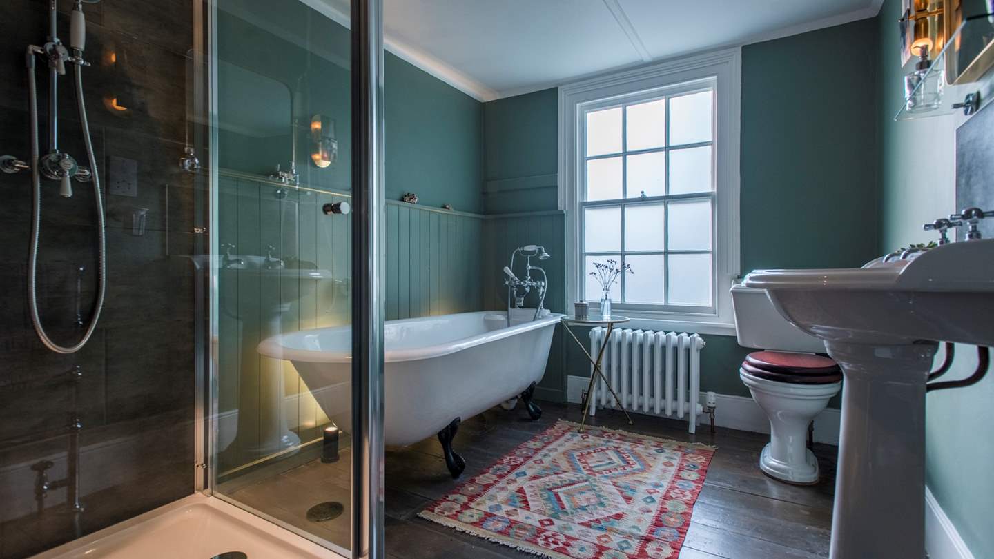 One of the bathrooms complete with huge walk-in shower and a deep luxurious bath