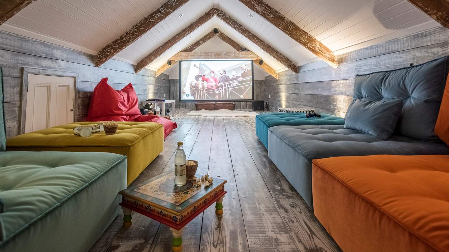 An incredible cinema room awaits, complete with funky velvet seats