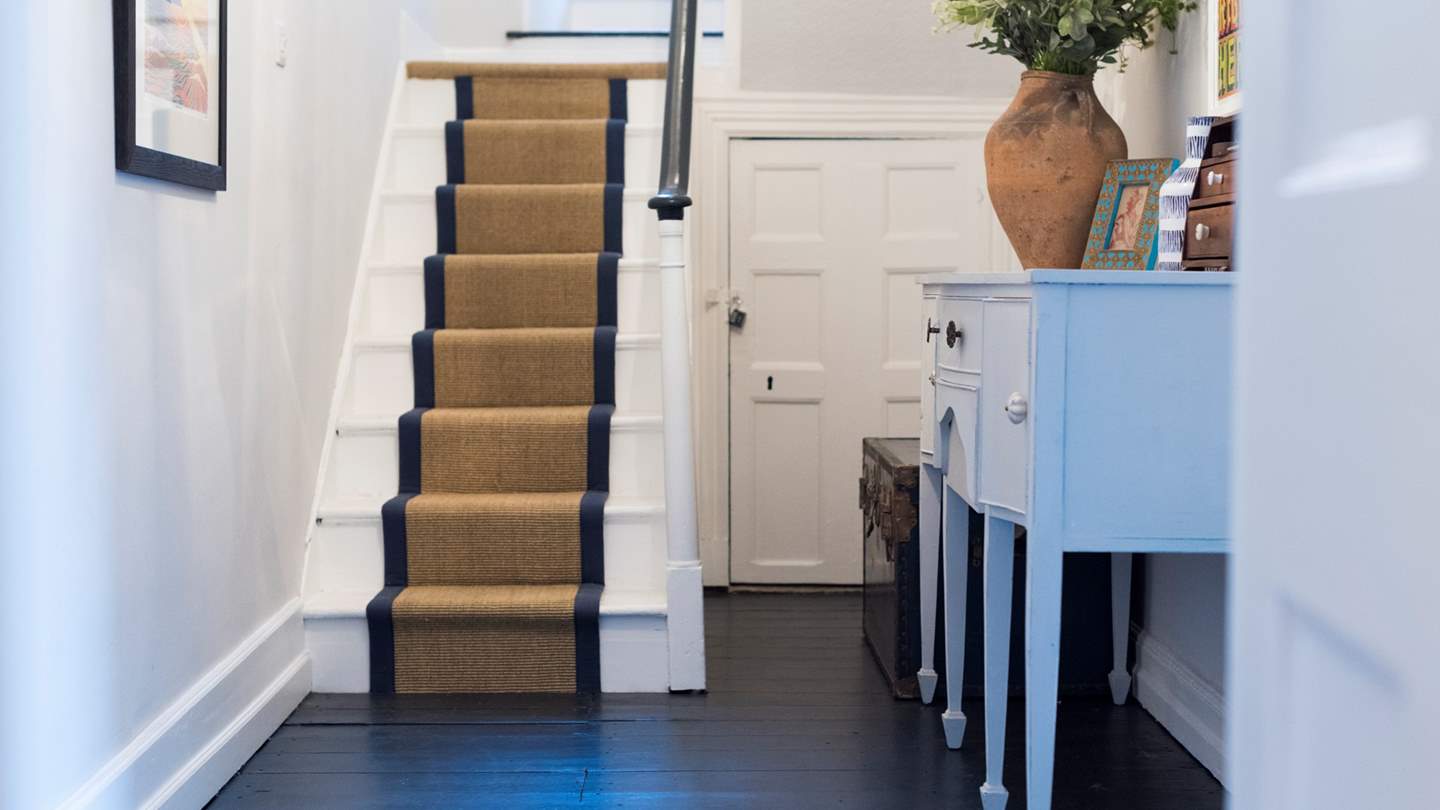 The pretty entrance hall is light, warm and welcoming