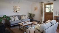 The cosy living room is a darling space to gather together