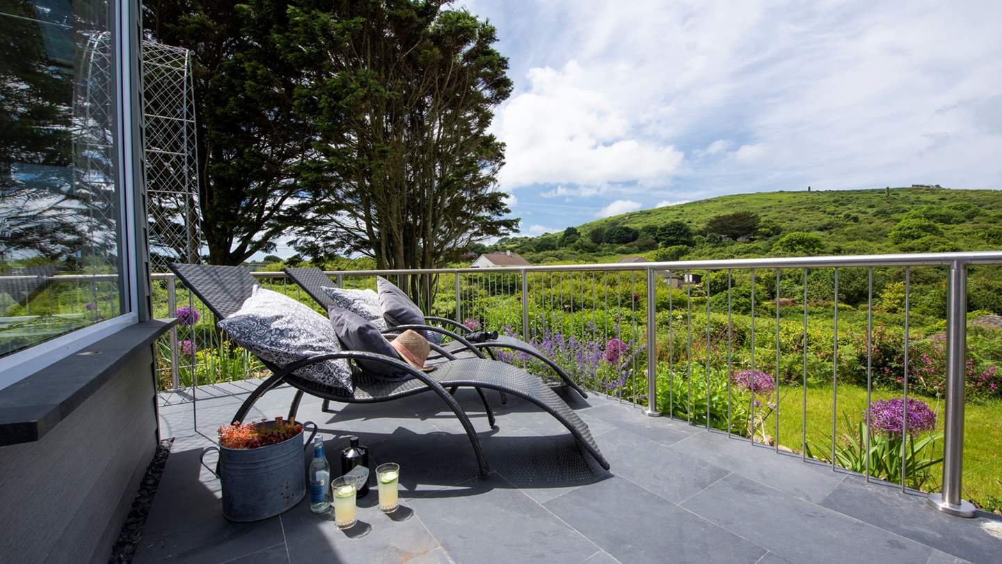 Take time out to unwind on the slate terrace which wraps around the sun room (loungers and deck chairs provided).