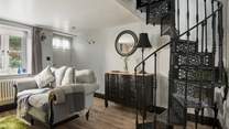 The gorgeous wrought iron staircase is the focal point of the cottage and leads directly into the bedroom.
