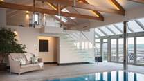 The heated indoor swimming pool looks out to Trevear's gorgeous grounds
