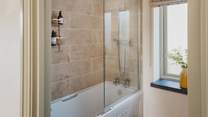 The family bathroom has a sumptuously deep bath with shower over. Both bathrooms have underfloor heating for additional luxury 
