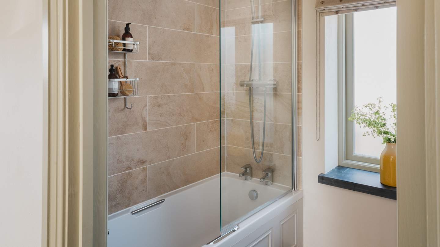 The family bathroom has a sumptuously deep bath with shower over. Both bathrooms have underfloor heating for additional luxury 

