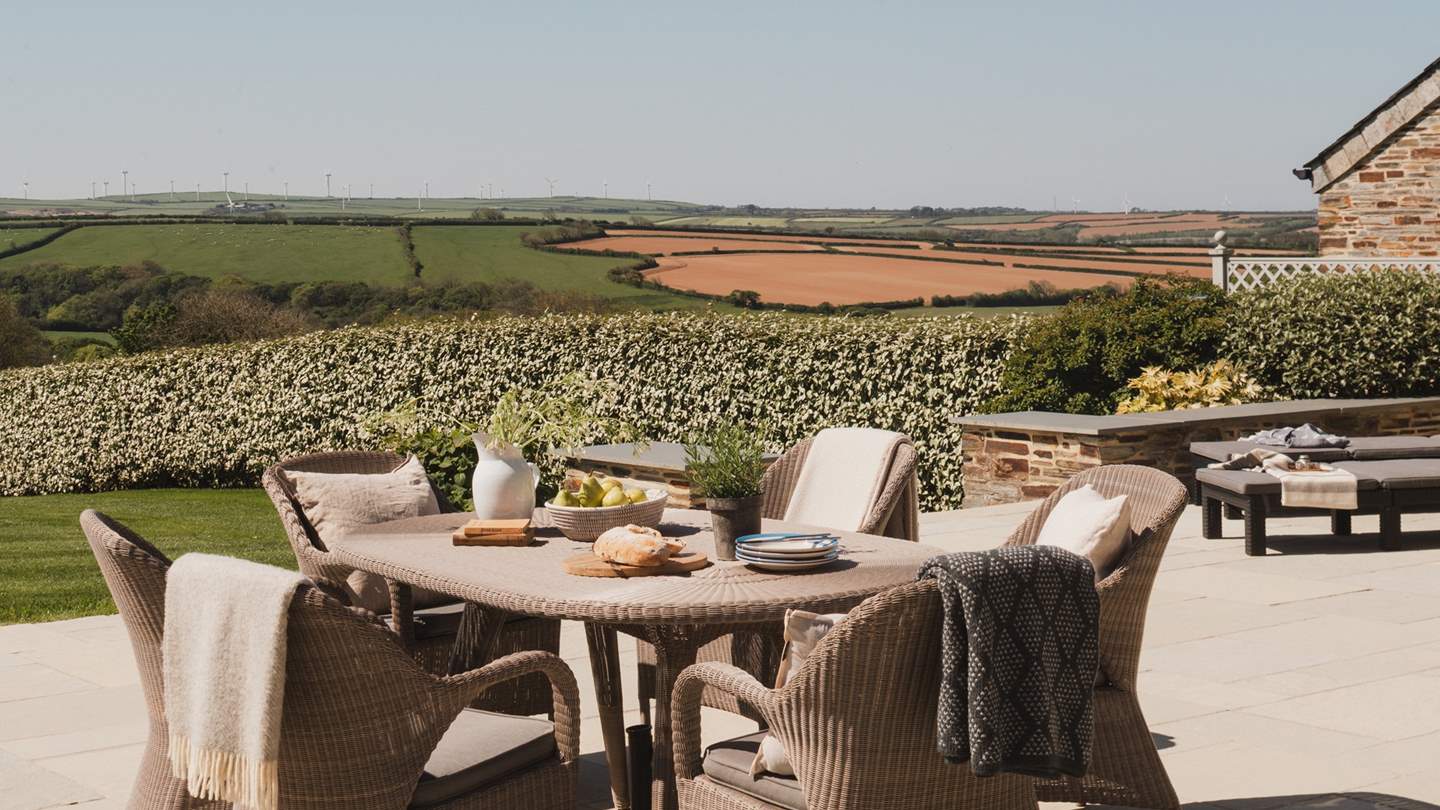 For outdoor dining on warm days, there's a table and chairs plus a BBQ
