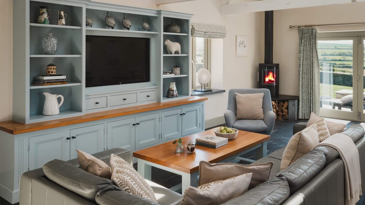 With high vaulted ceilings, slate tiled floors with underfloor heating and bespoke furniture throughout, this is a stylish retreat for a family yet perfect for couples too