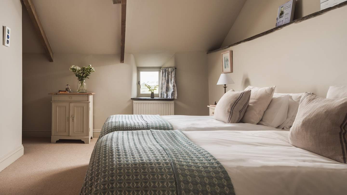 This pretty bedroom is perfect for little ones or friends