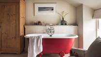 Nothing's more romantic than a bubbling bath for two - we just love the red colour