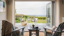 Roundhouse is an immaculately renovated cliff-top stone barn conversion with staggering sea views
