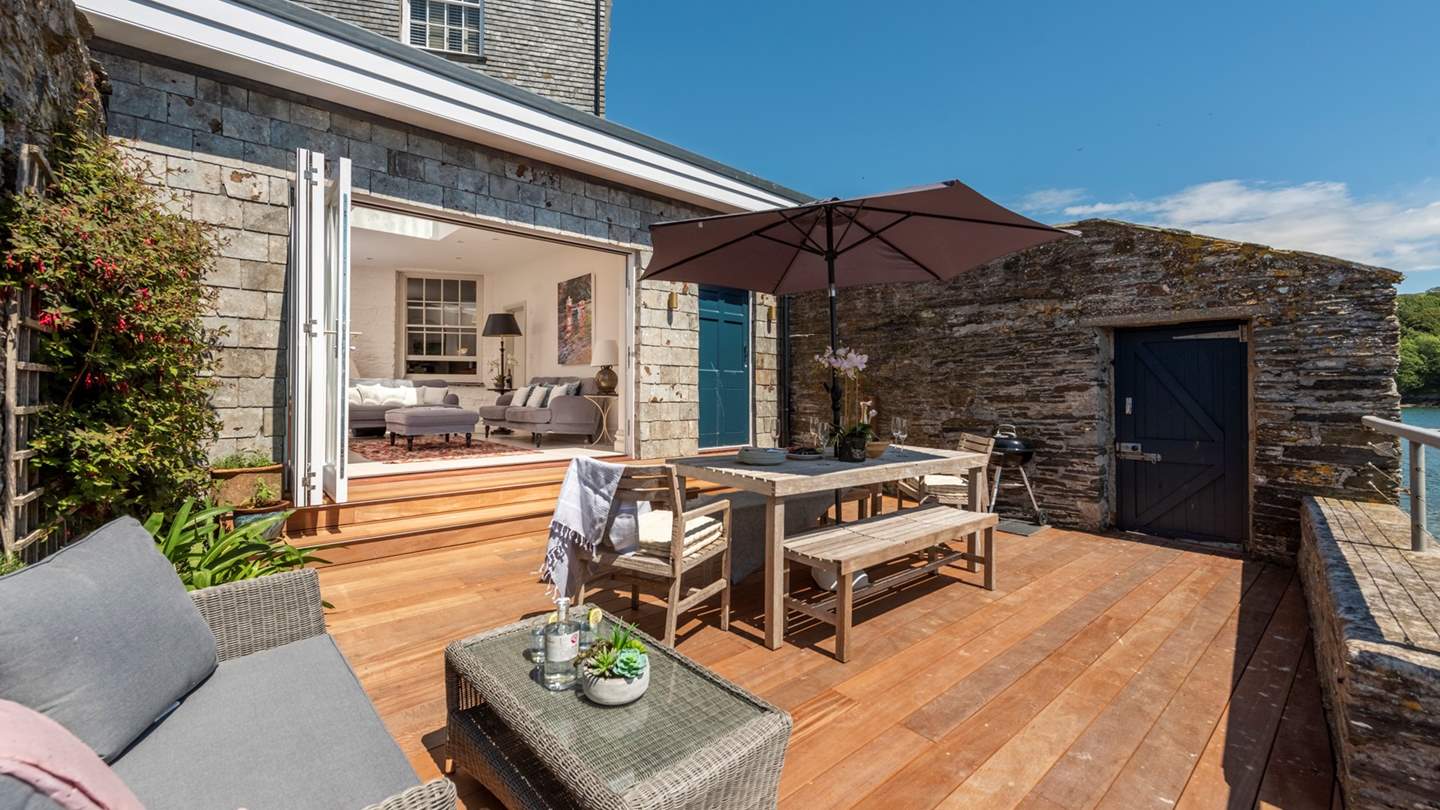 The gorgeous sunny deck is the perfect spot for sunbathing, dining and chatting.