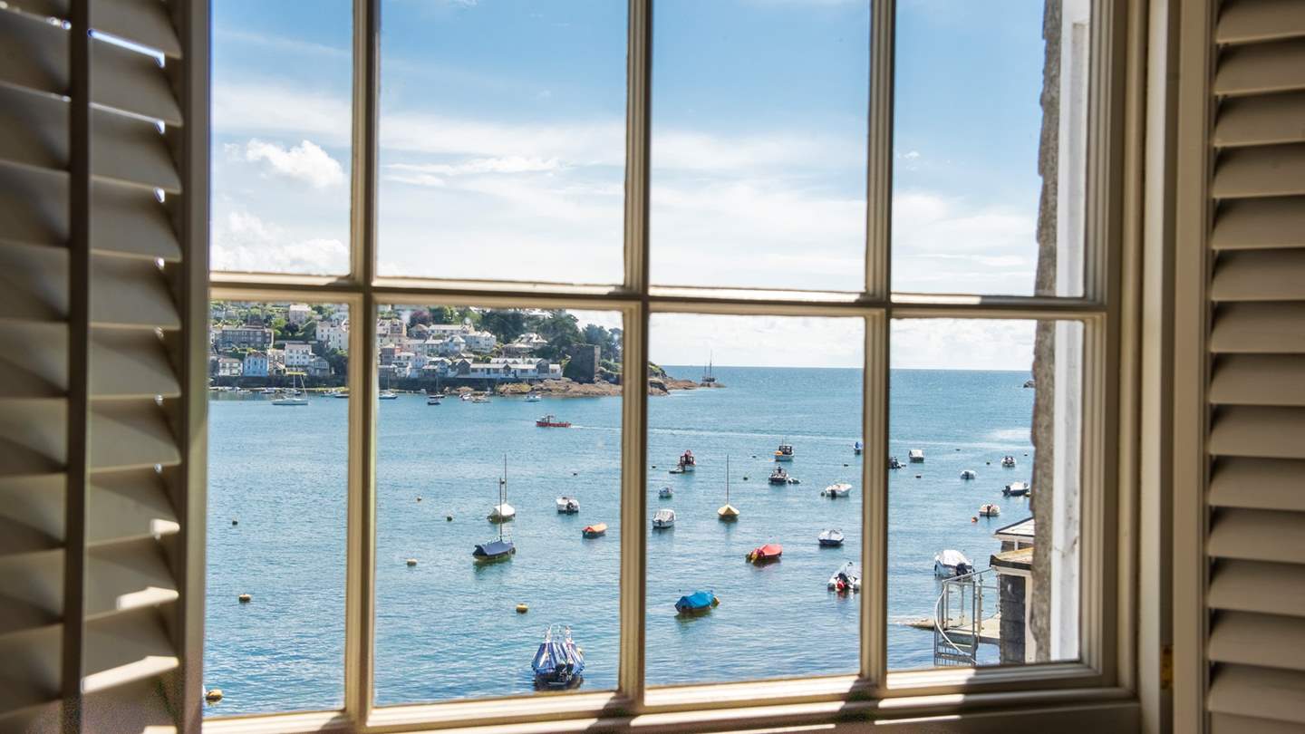 Set on the top floor, the master bedroom enjoys stunning views across the water and out to sea.
