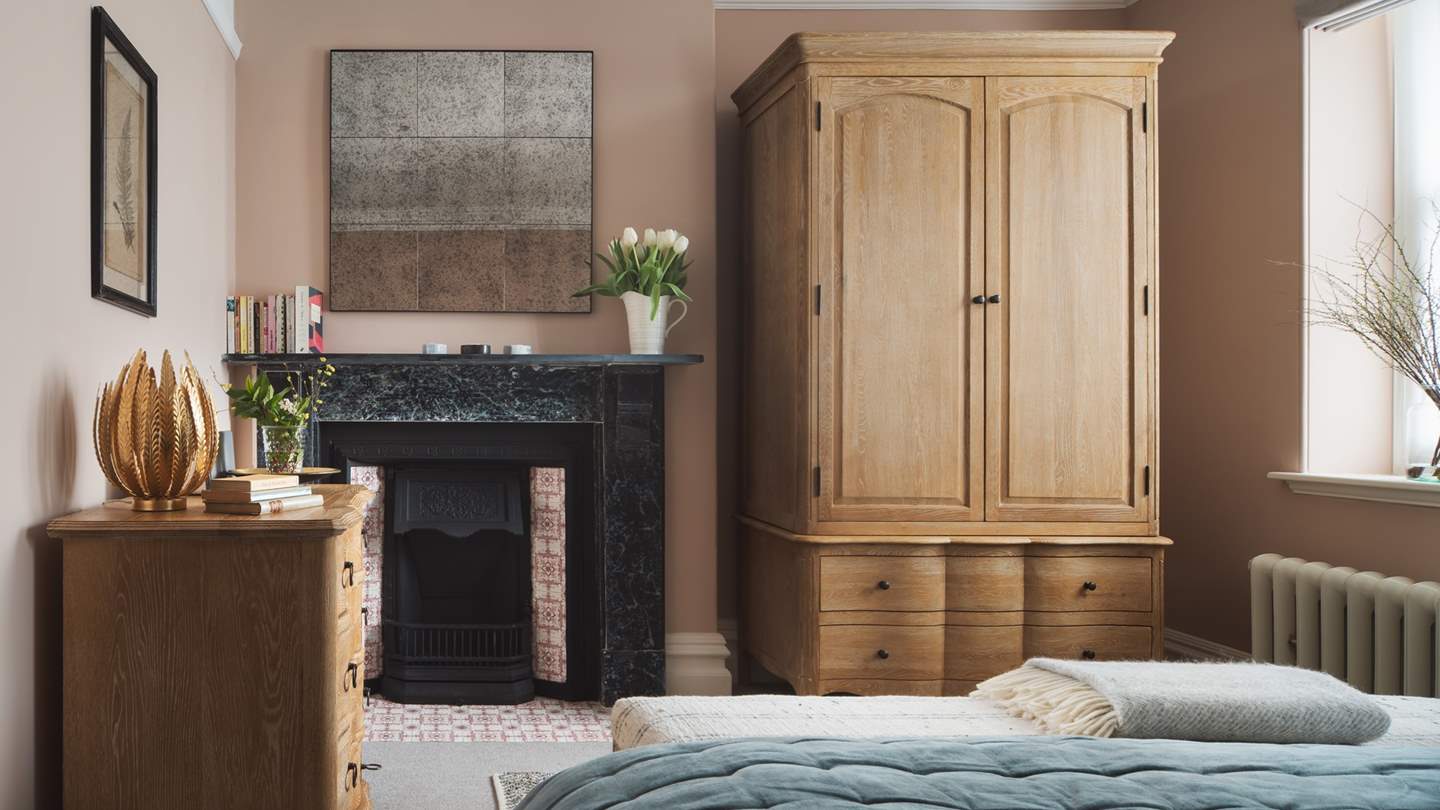 We just adore the original fireplace with intricate feature tiling 