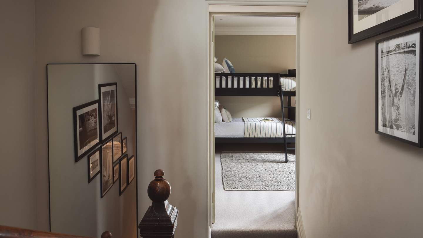 Discover the charming bunk room, a great space for the little ones