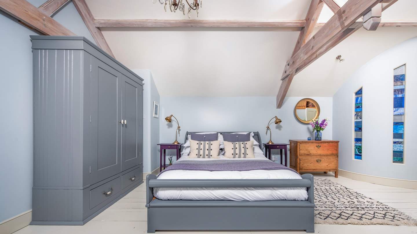 Airy vaulted ceilings, rustic wooden floorboards and a plush, sumptuous king size sleigh bed for long, lazy lie ins in the Master bedroom.