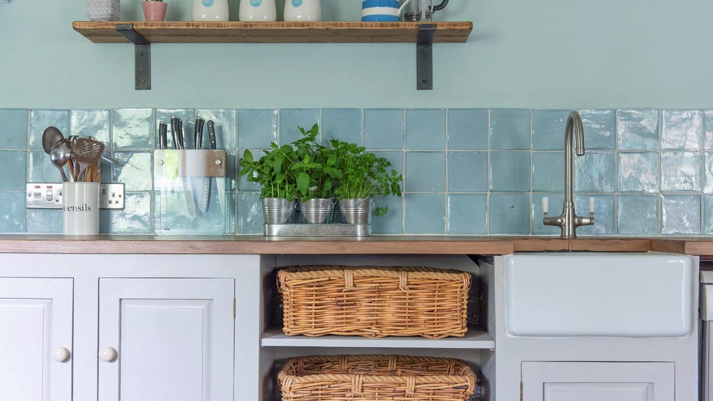 The kitchen bosts an electric Aga, separate Neff oven and hob, Smeg fridge freezer and all the modern appliances needed, including the all-important Nespresso machine.