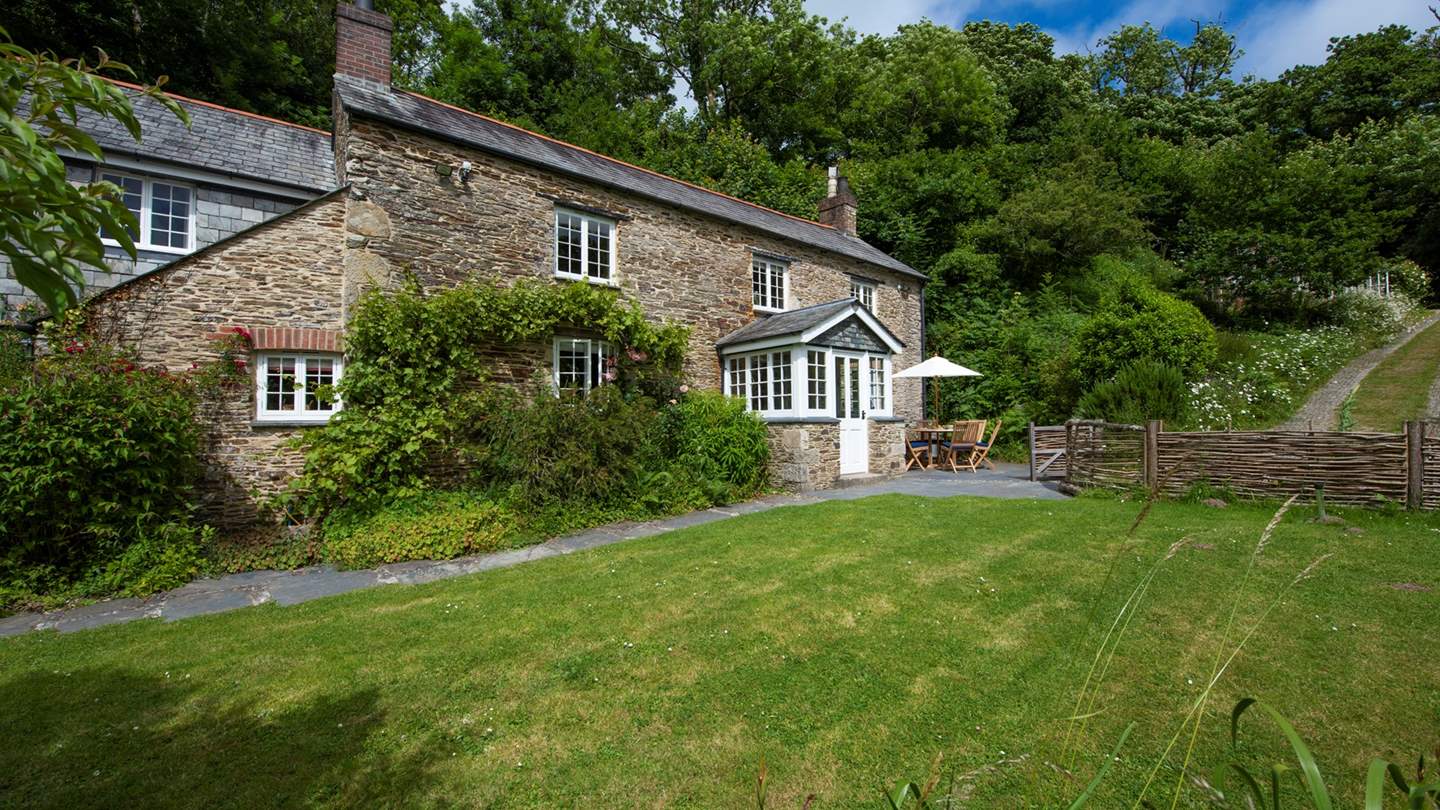 Hidden at the end of a meandering lane and set within a picturesque wildflower garden, Rose Cottage is the epitome of a traditional Cornish country home.