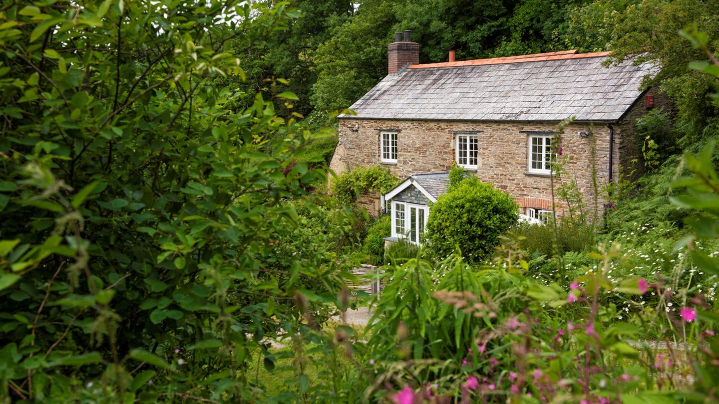 Hidden at the end of a meandering lane and set within a picturesque wildflower garden, Rose Cottage is the epitome of a traditional Cornish country home.