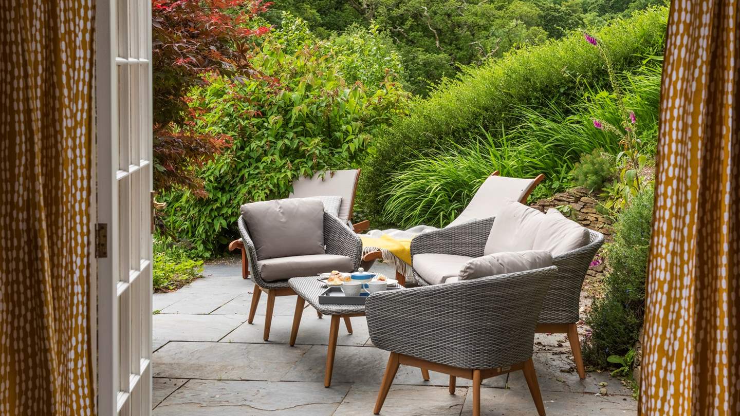 Step out from the sitting room to enjoy afternoon tea in one of the many hidden nooks of the garden.