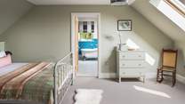 This bedroom has a beautiful ensuite bathroom, with a rolltop bath and separate walk-in shower 