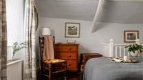 Vintage furnishings and original wooden flooring adds to the sweet charm of this quaint cottage 