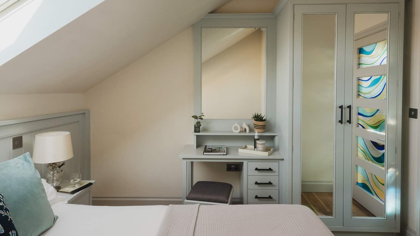 Beautifully crafted for moments of pamper the wooden dressing table and fitted wardrobe 