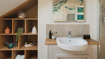 A spacious bathroom provides the perfect setting for refreshing wake-me-up moments