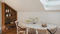 A dining table is tucked away in the living space which can be pulled out for more relaxing mealtimes