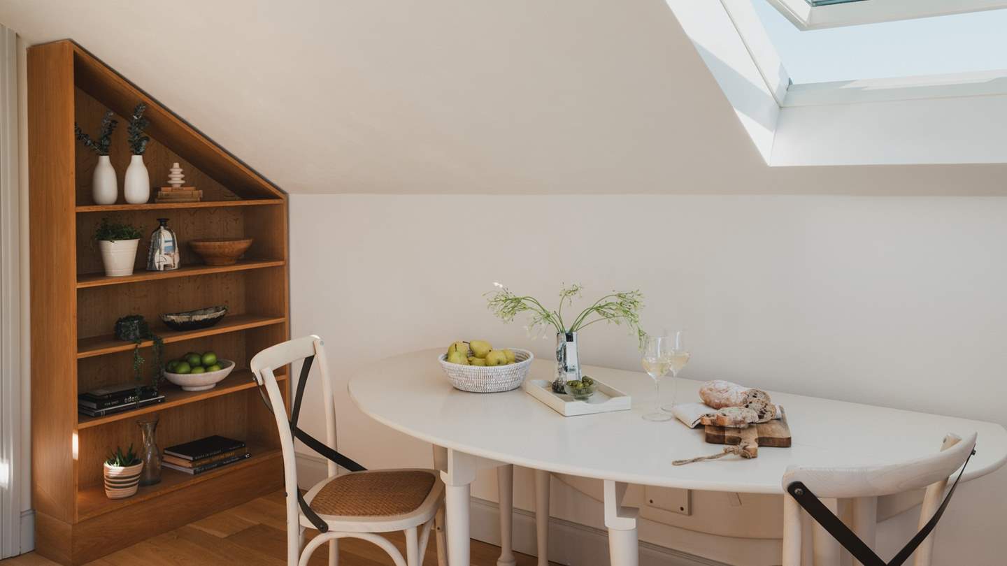 A dining table is tucked away in the living space which can be pulled out for more relaxing mealtimes