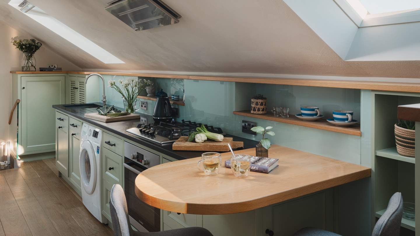 The cute galley kitchen is fully equipped with everything you need to create culinary masterpieces 