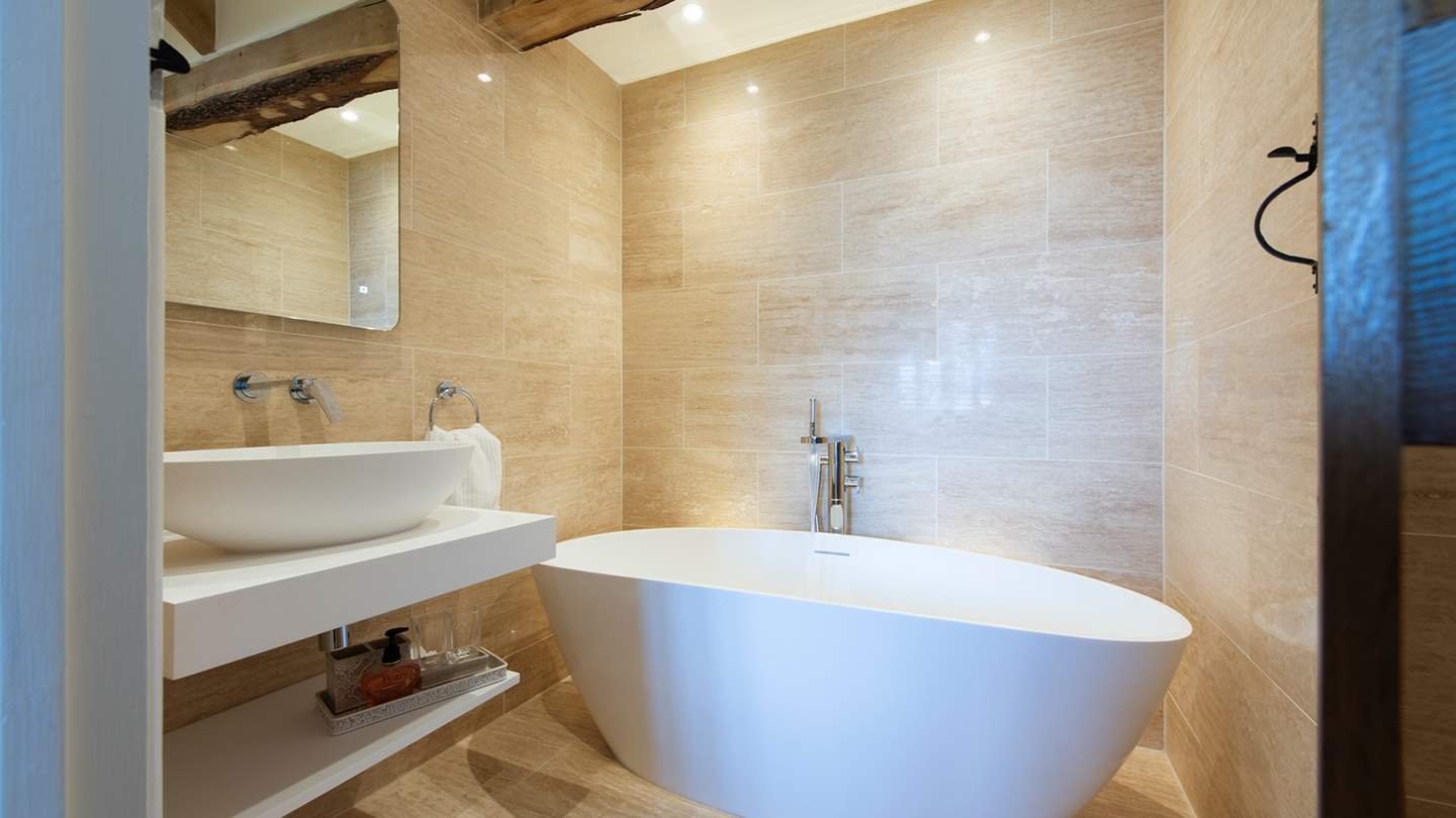 The master en suite bathroom has a gorgeous freestanding bath tub