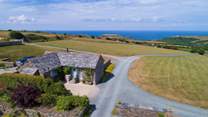 This exquisite stone barn conversion is the very essence of Cornish coastal chic