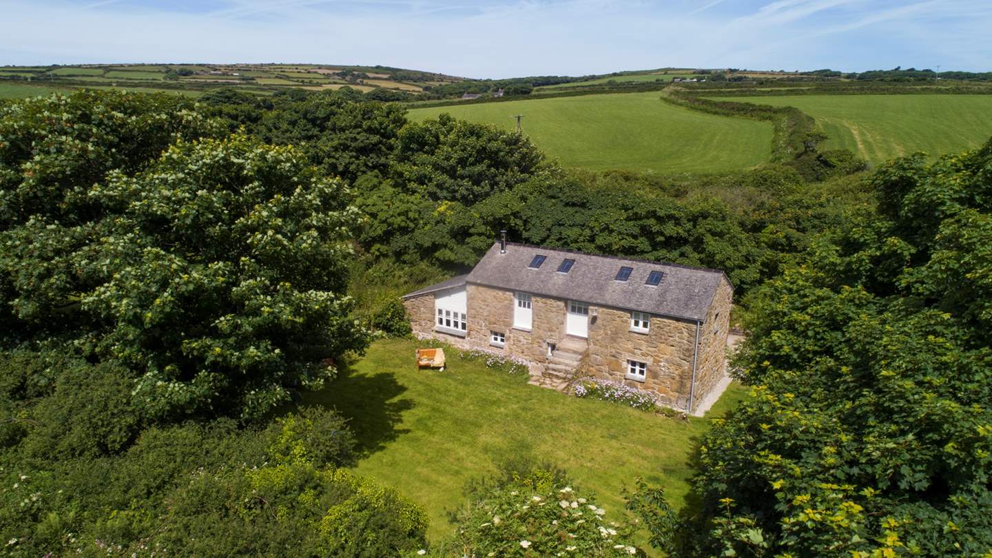 A lovingly converted 18th century cow barn nestled in the wilds of West Cornwall, this is an escape-it-all retreat for four.