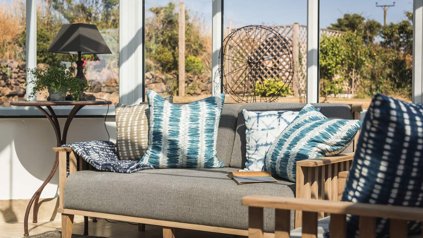 When it's sunny but cool out, this is the perfect spot to curl up with a book and your favourite tipple.