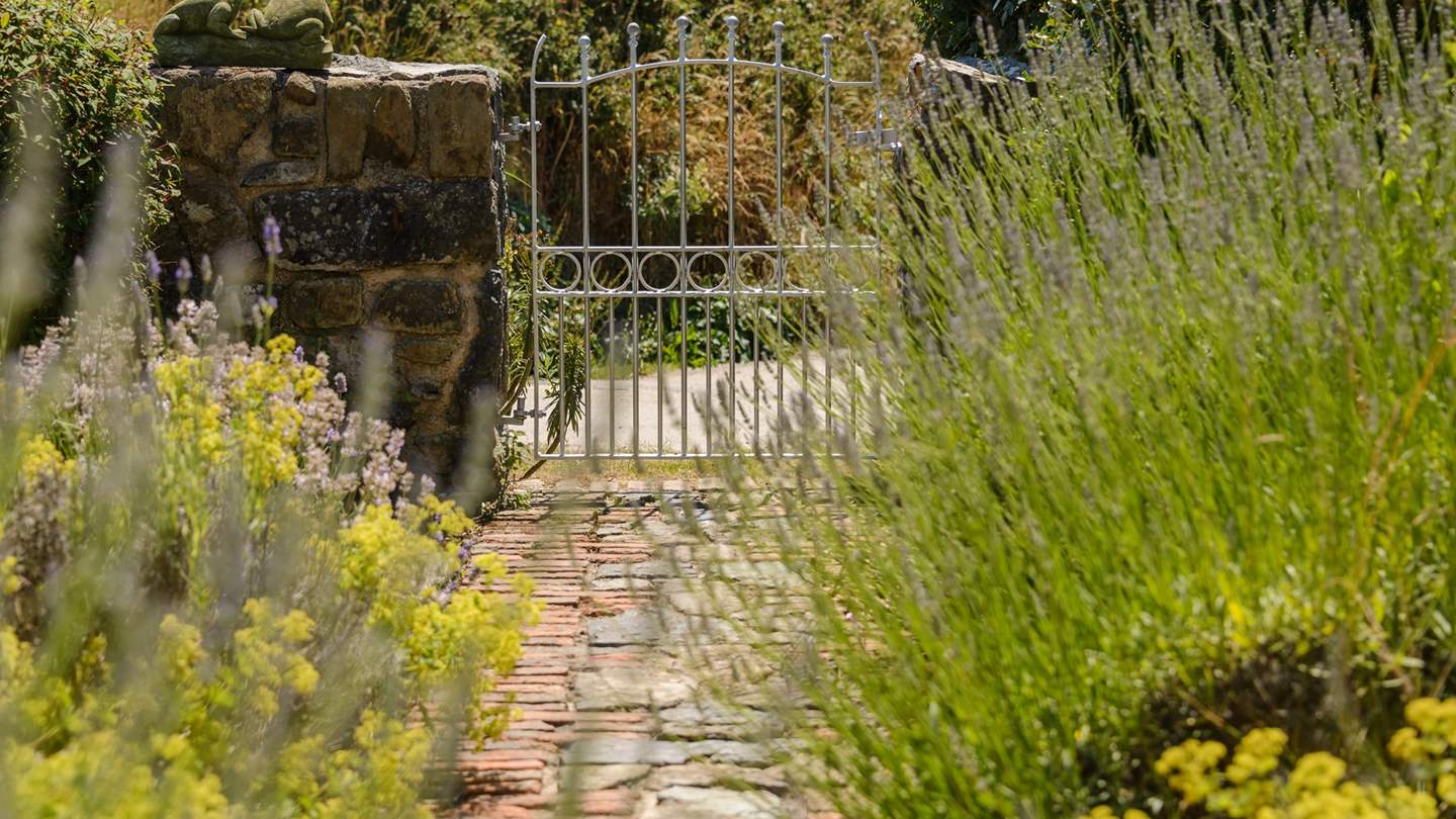We just love the lavender-lined cottage path that leads up to the front door.