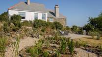 The main garden overlooks the fields and out to sea, and offers a peaceful spot to while away an afternoon or two.