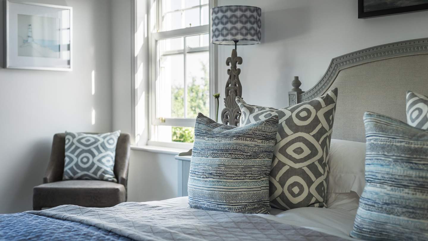 Peek through the window in the master bedroom and you'll spot the sea, and in the distance Mullion Cove.