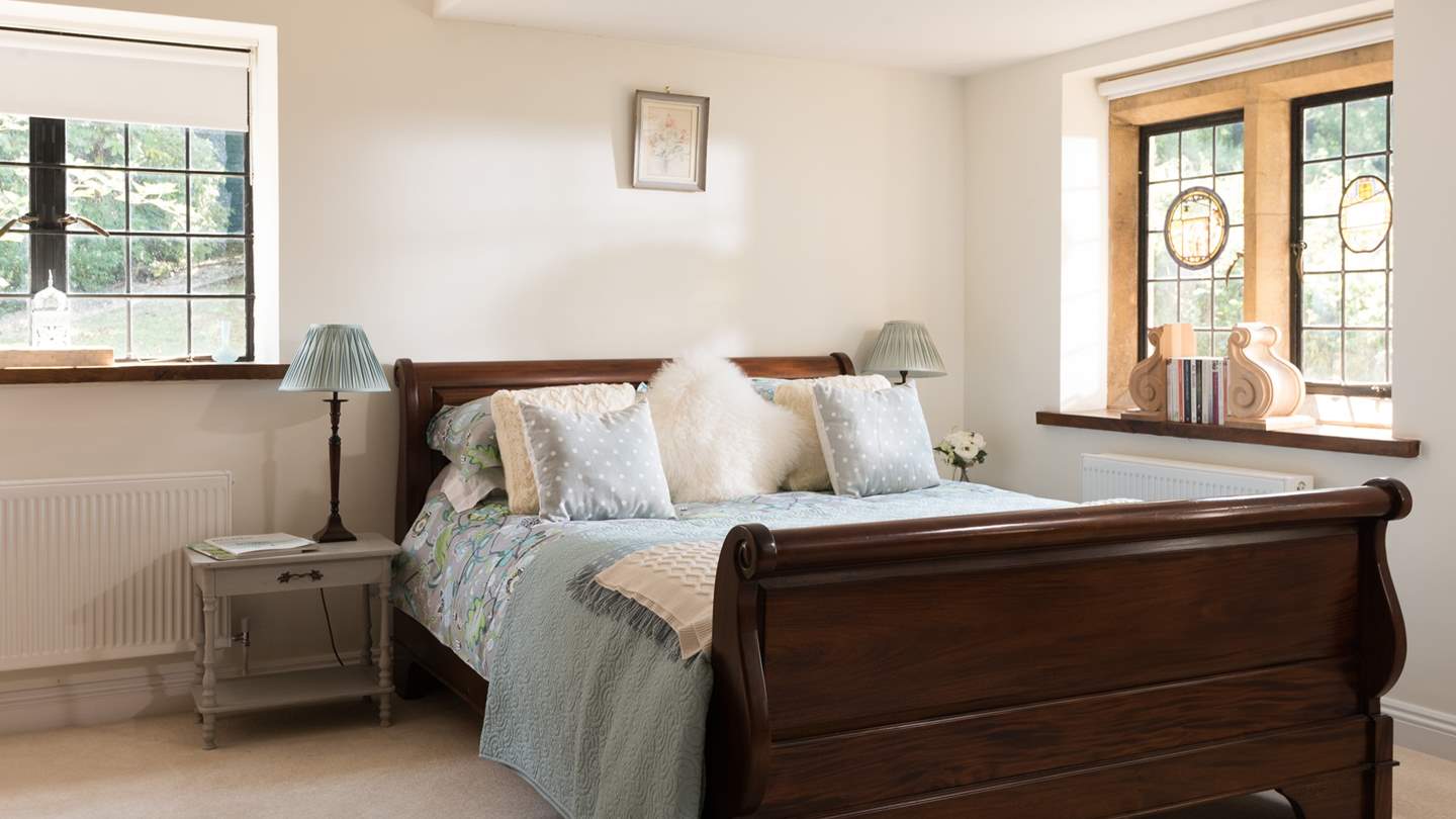 This bedroom offers delicate furnishings and sensational antique furniture.