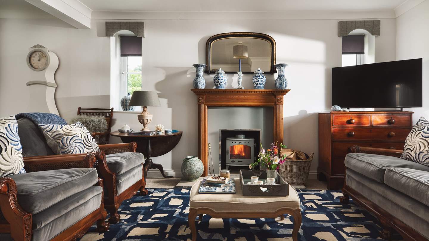 The sitting room is just stunning with a bijoux wood burning stove 