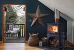 Nestle beside the flickering wood burning stove for cosy nights in