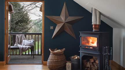 Nestle beside the flickering wood burning stove for cosy nights in