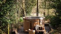 Tucked amongst the trees, you'll find the gorgeous wood-fired Eco hot tub 
