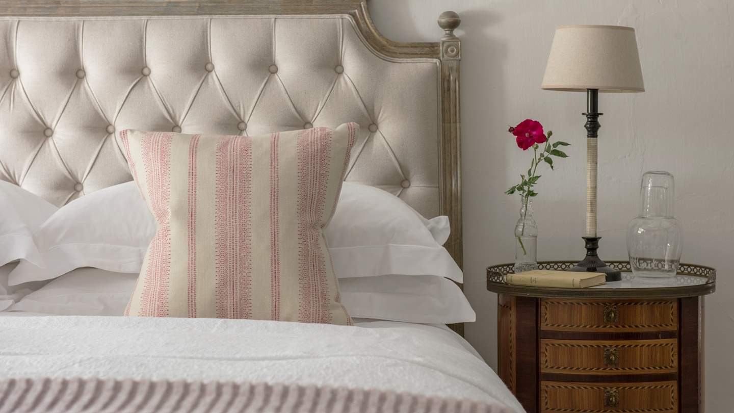 We just love the antique bedside table in the master bedroom.