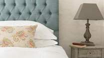 Kate Forman fabrics are used in both luxurious bedrooms.