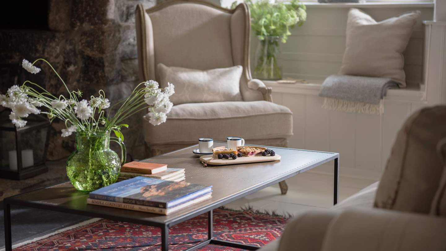 The stunning Persian rug completes the look in the sitting room.