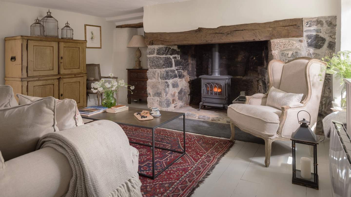 The original fireplace in the sitting room is beautiful and even has the original 17th century bread oven attached!