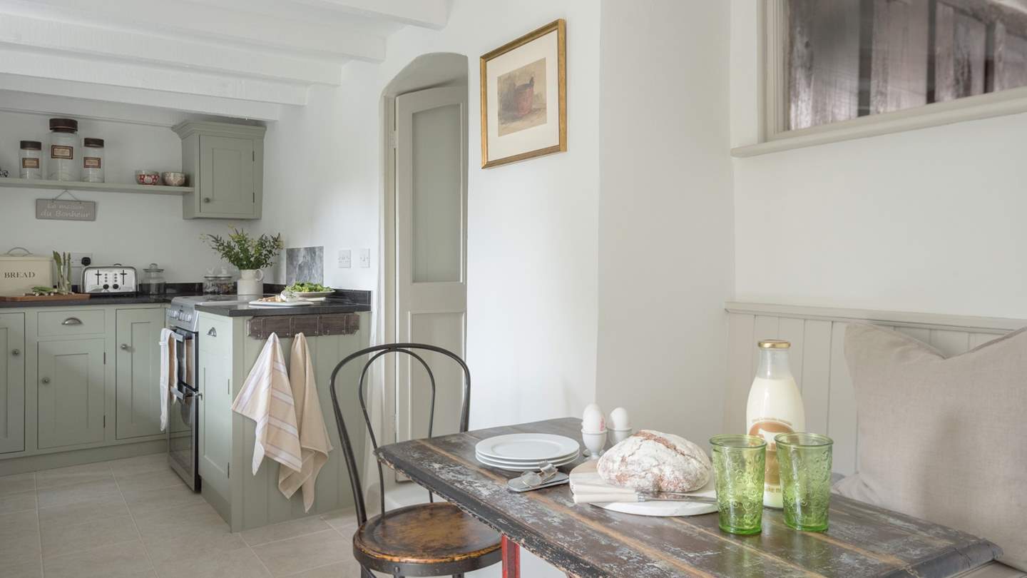 The cute breakfast table is tucked away in the kitchen.