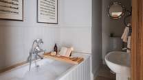 The en suite bathroom with an indulgently deep bath beckons blissful soaks 